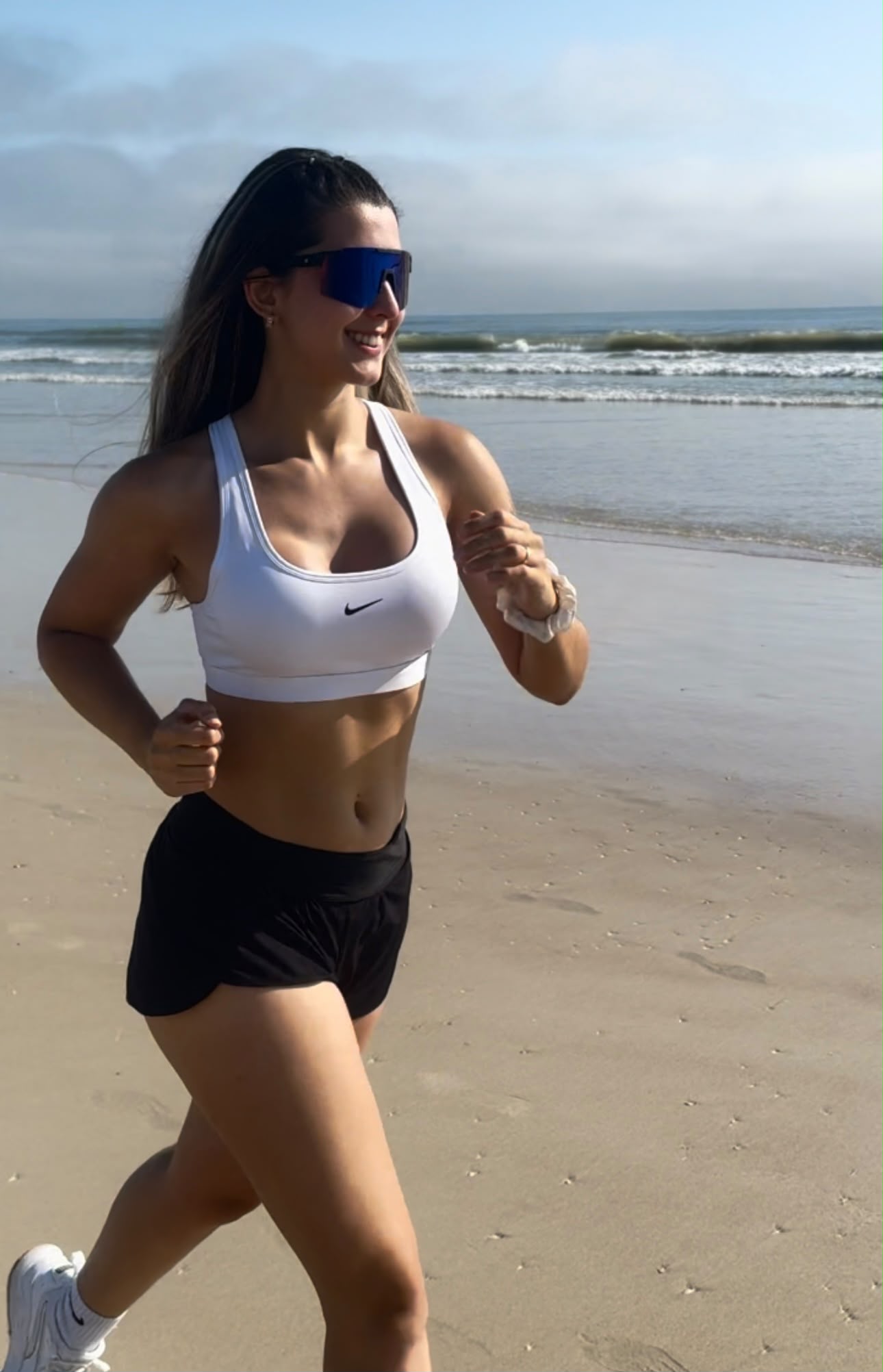 Running on the beach in Nike activewear